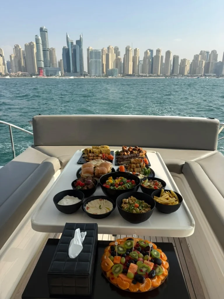 Private yacht cruising past the Dubai Marina skyline